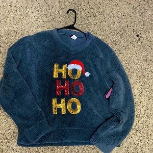 A grey 100% polyester X-Large fluffy crew neck.